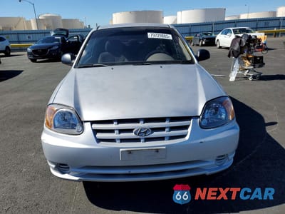 Piąte zdjęcie samochodu w środku: 2003 HYUNDAI ACCENT BASE VIN:KMHCF35C13U260030 - miniatura