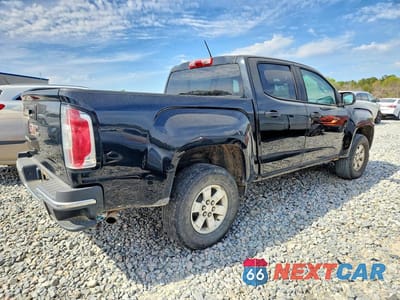 Trzecie zdjęcie samochodu z tyłu: 2018 GMC CANYON VIN:1GTG5BEN3J1127353 - miniatura