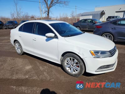 Czwarte zdjęcie samochodu z boku: 2015 VOLKSWAGEN JETTA BASE VIN:3VW1K7AJ9FM267560 - miniatura