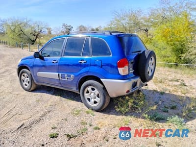 Trzecie zdjęcie samochodu z tyłu: 2003 TOYOTA RAV4 BASE VIN:JTEGH20V030087140 - miniatura