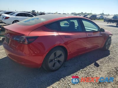 Trzecie zdjęcie samochodu z tyłu: 2021 TESLA MODEL 3 VIN:5YJ3E1EB1MF974110 - miniatura