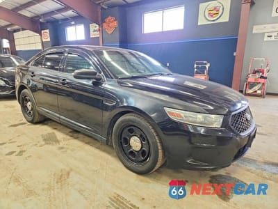 Czwarte zdjęcie samochodu z boku: 2014 FORD TAURUS POLICE INTERCEPTOR VIN:1FAHP2MT9EG100052 - miniatura