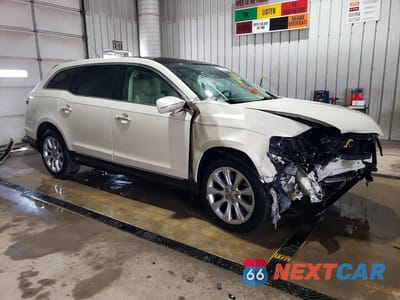 Czwarte zdjęcie samochodu z boku: 2015 LINCOLN MKT VIN:2LMHJ5FK5FBL03191 - miniatura