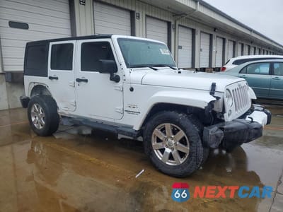 Czwarte zdjęcie samochodu z boku: 2016 JEEP WRANGLER UNLIMITED SAHARA VIN:1C4HJWEG3GL106377 - miniatura