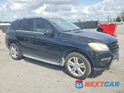 Czwarte zdjęcie samochodu z boku: 2015 MERCEDES-BENZ ML 350 VIN:4JGDA5JB5FA500066 - miniatura