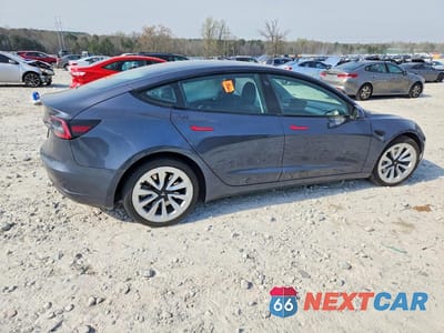 Trzecie zdjęcie samochodu z tyłu: 2022 TESLA MODEL 3 VIN:5YJ3E1EA7NF285942 - miniatura
