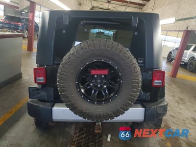 Zdjęcie 6 z 13 samochodu: 2010 JEEP WRANGLER UNLIMITED SAHARA VIN:1J4BA5H12AL122496 - miniatura