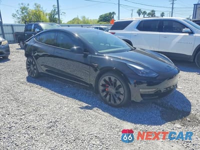 Czwarte zdjęcie samochodu z boku: 2023 TESLA MODEL 3 VIN:5YJ3E1ECXPF586063 - miniatura