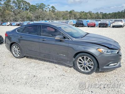 Czwarte zdjęcie samochodu z boku: 2017 FORD FUSION SE HYBRID VIN:3FA6P0LU9HR344920 - miniatura