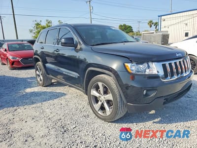 Czwarte zdjęcie samochodu z boku: 2012 JEEP GRAND CHEROKEE LAREDO VIN:1C4RJFAG2CC164968 - miniatura