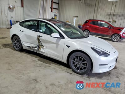 Czwarte zdjęcie samochodu z boku: 2022 TESLA MODEL 3 VIN:5YJ3E1EB1NF334884 - miniatura