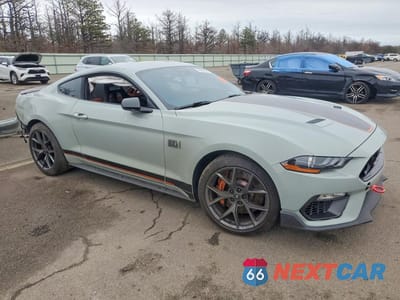 Czwarte zdjęcie samochodu z boku: 2021 FORD MUSTANG MACH I VIN:1FA6P8R06M5550082 - miniatura