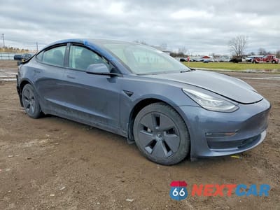 Czwarte zdjęcie samochodu z boku: 2022 TESLA MODEL 3 VIN:5YJ3E1EB4NF261025 - miniatura