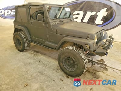 Czwarte zdjęcie samochodu z boku: 2000 JEEP WRANGLER / TJ SAHARA VIN:1J4FA59SXYP782863 - miniatura