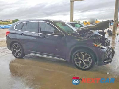 Czwarte zdjęcie samochodu z boku: 2018 BMW X1 XDRIVE28I VIN:WBXHT3C3XJ5K22635 - miniatura