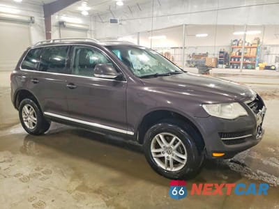Czwarte zdjęcie samochodu z boku: 2010 VOLKSWAGEN TOUAREG V6 VIN:WVGBF7A91AD002584 - miniatura
