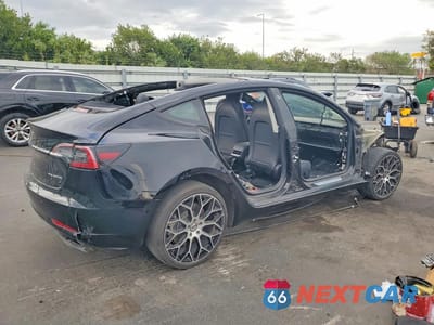 Trzecie zdjęcie samochodu z tyłu: 2019 TESLA MODEL 3 VIN:5YJ3E1EB2KF432463 - miniatura
