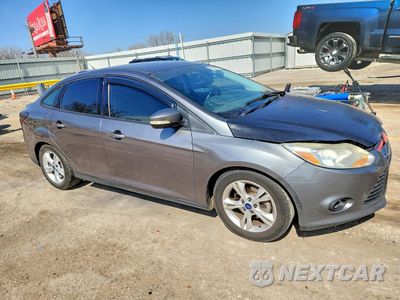 Czwarte zdjęcie samochodu z boku: 2014 FORD FOCUS SE VIN:1FADP3F24EL209034 - miniatura