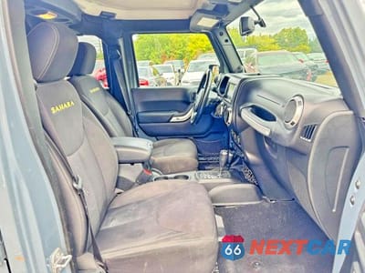Piąte zdjęcie samochodu w środku: 2014 JEEP WRANGLER UNLIMITED SAHARA VIN:1C4BJWEG1EL304085 - miniatura