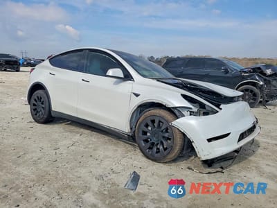 Czwarte zdjęcie samochodu z boku: 2023 TESLA MODEL Y VIN:7SAYGDEE1PA123585 - miniatura