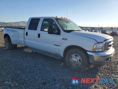 Czwarte zdjęcie samochodu z boku: 2001 FORD F350 SUPER DUTY VIN:1FTWW32F21EC31496 - miniatura