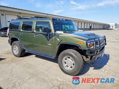 Czwarte zdjęcie samochodu z boku: 2003 HUMMER H2 VIN:5GRGN23U43H107700 - miniatura