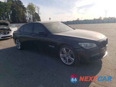 Czwarte zdjęcie samochodu z boku: 2014 BMW 750 LI VIN:WBAYE8C59ED135016 - miniatura