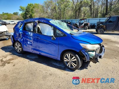 Czwarte zdjęcie samochodu z boku: 2016 HONDA FIT EX VIN:JHMGK5H70GX006470 - miniatura