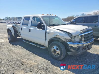 Czwarte zdjęcie samochodu z boku: 2002 FORD F350 SUPER DUTY VIN:1FTWW33SX2EA65581 - miniatura