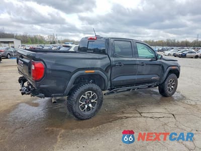 Trzecie zdjęcie samochodu z tyłu: 2025 GMC CANYON AT4 VIN:1GTP2DEKXS1241894 - miniatura