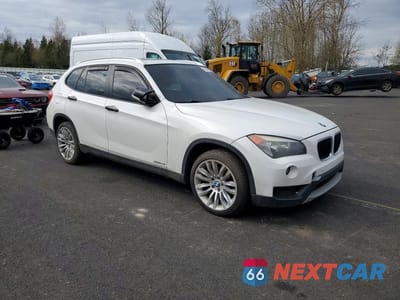Czwarte zdjęcie samochodu z boku: 2013 BMW X1 XDRIVE28I VIN:WBAVL1C50DVR82919 - miniatura