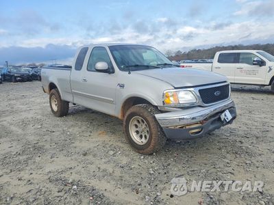 Czwarte zdjęcie samochodu z boku: 2000 FORD F150 VIN:1FTRX18WXYNB75341 - miniatura