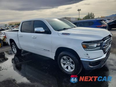 Czwarte zdjęcie samochodu z boku: 2023 RAM 1500 LARAMIE VIN:1C6SRFJM0PN557529 - miniatura
