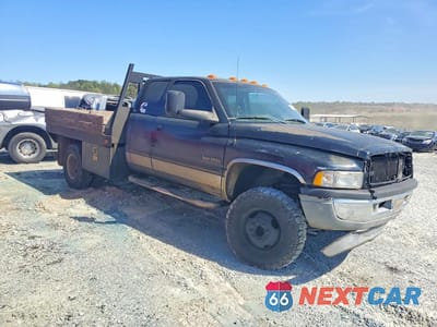 Czwarte zdjęcie samochodu z boku: 1999 DODGE RAM 3500 FLATBED TRUCK VIN:1B7MF3366XJ528311 - miniatura