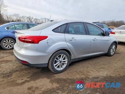 Trzecie zdjęcie samochodu z tyłu: 2017 FORD FOCUS SE VIN:1FADP3F21HL312335 - miniatura