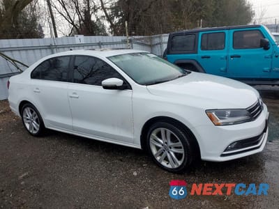 Czwarte zdjęcie samochodu z boku: 2017 VOLKSWAGEN JETTA SEL VIN:3VWL17AJ1HM351189 - miniatura