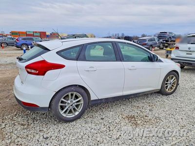 Trzecie zdjęcie samochodu z tyłu: 2016 FORD FOCUS SE VIN:1FADP3K27GL294797 - miniatura