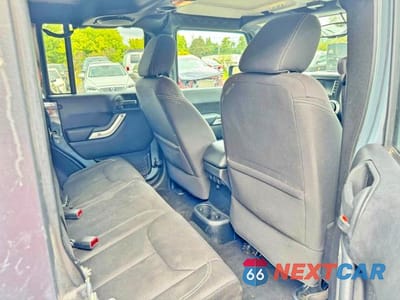 Zdjęcie 6 z 10 samochodu: 2014 JEEP WRANGLER UNLIMITED SAHARA VIN:1C4BJWEG1EL304085 - miniatura