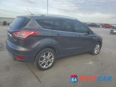 Trzecie zdjęcie samochodu z tyłu: 2016 FORD ESCAPE TITANIUM VIN:1FMCU9JX5GUB54669 - miniatura