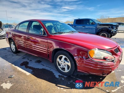 Czwarte zdjęcie samochodu z boku: 2000 PONTIAC GRAND AM SE1 VIN:1G2NF52T4YC548316 - miniatura