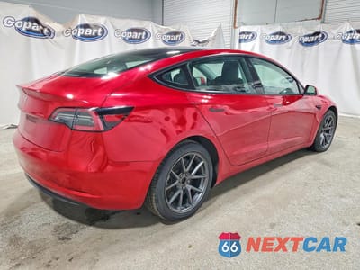 Trzecie zdjęcie samochodu z tyłu: 2023 TESLA MODEL 3 VIN:5YJ3E1EA1PF437104 - miniatura