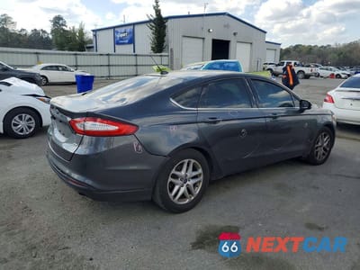 Trzecie zdjęcie samochodu z tyłu: 2016 FORD FUSION SE VIN:1FA6P0H70G5107141 - miniatura