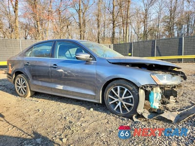 Czwarte zdjęcie samochodu z boku: 2017 VOLKSWAGEN JETTA SE VIN:3VWDB7AJ7HM372551 - miniatura