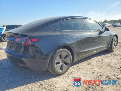 Trzecie zdjęcie samochodu z tyłu: 2023 TESLA MODEL 3 VIN:5YJ3E1EA6PF704303 - miniatura