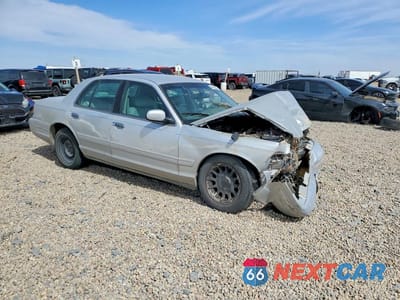 Czwarte zdjęcie samochodu z boku: 1999 FORD CROWN VICTORIA LX VIN:2FAFP74W9XX127327 - miniatura