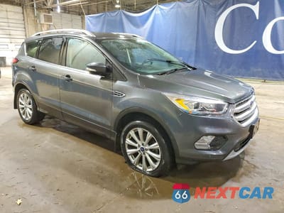 Czwarte zdjęcie samochodu z boku: 2018 FORD ESCAPE TITANIUM VIN:1FMCU9J99JUA79774 - miniatura
