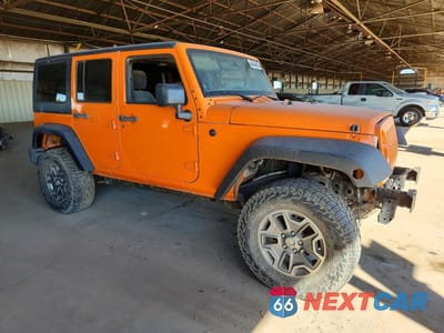 Czwarte zdjęcie samochodu z boku: 2013 JEEP WRANGLER UNLIMITED RUBICON VIN:1C4BJWFG1DL560692 - miniatura