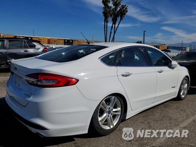 Trzecie zdjęcie samochodu z tyłu: 2018 FORD FUSION SE HYBRID VIN:3FA6P0LU1JR129960 - miniatura