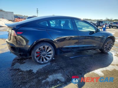 Trzecie zdjęcie samochodu z tyłu: 2023 TESLA MODEL 3 VIN:5YJ3E1EC1PF507217 - miniatura