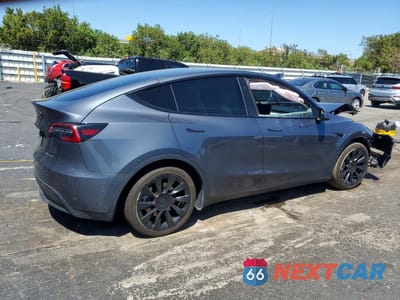 Trzecie zdjęcie samochodu z tyłu: 2023 TESLA MODEL Y VIN:7SAYGDEE7PA141475 - miniatura